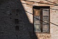 Wooden window of an old red brick building Royalty Free Stock Photo