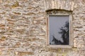 Wooden window in an old stone barn farm building Royalty Free Stock Photo