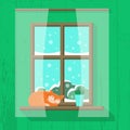 Wooden window with snowy landscape view. Red cat is sleeping and a house plant is standing on the windowsill Royalty Free Stock Photo