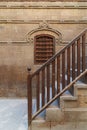 Wooden window and staircase with wooden balustrade leading to historic building, Old Cairo, Egypt Royalty Free Stock Photo