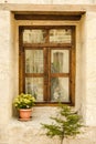 Wooden window on stone wall.