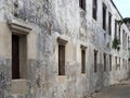 Wooden Windows on the Old White Concrete Wall Royalty Free Stock Photo