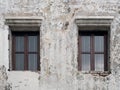 Wooden Windows on the Old White Concrete Wall Royalty Free Stock Photo