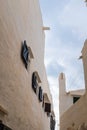 Wooden windows open on a white wall in a famous landmark in Menorca, Spain Royalty Free Stock Photo