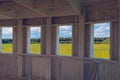 Wooden windows summer view. Window portal to the summer nature landscape. Meadow picturesque summer landscape with clouds on blue