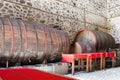 Wooden wine barrels in an underground cellar