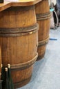 Wooden wine barrels for vineyards decorated with ivy leaves and bunches of grapes Royalty Free Stock Photo