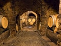 Wooden wine barrels in a wine cellar in Piedmont Royalty Free Stock Photo