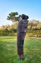 Wooden woman head sculpture on the beach promenade on the island Usedom Royalty Free Stock Photo