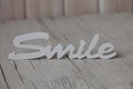 Wooden word smile