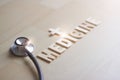 Wooden wording of medicine and stethoscope on wooden background, Abstract symbol, Medical and healthcare concept