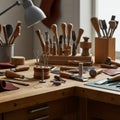 A wooden workbench filled with leatherworking tools, including awls, mallets, and Royalty Free Stock Photo