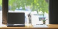 Workspace is surrounding by a computer laptop, vase of pencils. Royalty Free Stock Photo