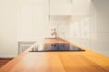 Wooden worktop and cooktop closeup in new kitchen / kitchenette