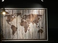 Wooden world map at cafe under dim light