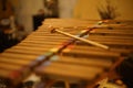 Wooden xylophone and wooden sticks.