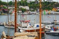 Wooden yachts with high masts moored at the marina Royalty Free Stock Photo