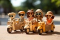 Wooden yellow toy motor bikes and with black wheals and woman with hats and sunglasses. Blurred green background. Copy