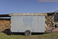 Woodfire and trailer at swiss farm in Bern. Royalty Free Stock Photo