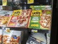 Woodinville, WA USA - circa April 2022: Angled view of Udi`s brand gluten free pizzas for sale inside the freezer section of a