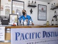 Woodinville, WA USA - circa August 2021: Angled view of a Causcasian man giving a gin and vodka tasting at Pacific Distillery
