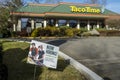 Woodinville, WA USA - circa February 2022: Street view of a Taco Time fast food restaurant`s Now Hiring sign on a bright, sunny