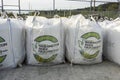 Woodinville, WA USA - circa May 2022: View of large bags of infill sand for a baseball field in a parking lot