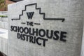 Woodinville, WA USA - circa September 2021: View of the Woodinville Schoolhouse District sign in downtown Woodinville