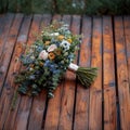 Woodland elegance close up of rustic bouquet on wooden floor