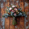 Woodland elegance close up of rustic bouquet on wooden floor