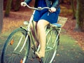 Redhead lady cycling in park Royalty Free Stock Photo