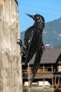Woodpecker. Decorative ironwork sculpture.