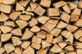 Woodpile from chopped birch firewood with bark and knots Royalty Free Stock Photo