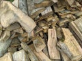 Woodpile of firewood stacked on the ground. Firewood for the cold winter season. Various logs. Close-up Royalty Free Stock Photo