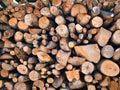 Woodpile lies in a heap, chopped for burning in a furnace. Finely chopped and stacked firewood, background. Laid dry Royalty Free Stock Photo