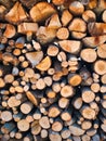 Woodpile lies in a heap, chopped for burning in a furnace. Finely chopped and stacked firewood, background. Laid dry Royalty Free Stock Photo