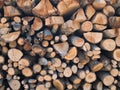 Woodpile lies in a heap, chopped for burning in a furnace. Finely chopped and stacked firewood, background. Laid dry Royalty Free Stock Photo