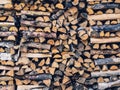 Woodpile with a lot of birch and spruce logs. Chopped a lot of firewood neatly stacked in a pile, background, texture. Harvesting Royalty Free Stock Photo