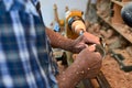 The woodturner work. Man`s arms with cutter in action. Royalty Free Stock Photo