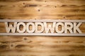 WOODWORK word made with building blocks on wooden board