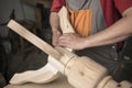 Carpenter makes a table with carved legs