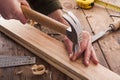 Woodworker hammer a nail Royalty Free Stock Photo