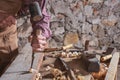 Woodworker using chisel to smooth down wood