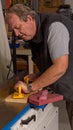 Woodworker using a jointing machine Royalty Free Stock Photo