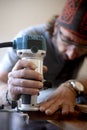 Woodworker using a router for woodworking