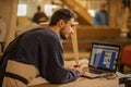 Woodworker watching the project of making wooden chair