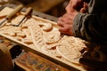 Woodworking Artistry: Masterful Carpenter Crafting Detailed Designs on Wood