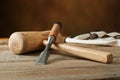 Woodworking tolls, chisels and mallet on workbench