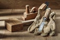 Woodworking tools wooden mallet chisel gloves and woodworkers plane