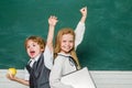 Woohoo. Cheerful smiling child at the blackboard. Schoolchild. Book school and kids. Classroom. School lessons. Yeah Royalty Free Stock Photo